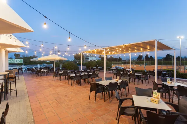 Club de Tenis Oliva restaurant terrace at dusk